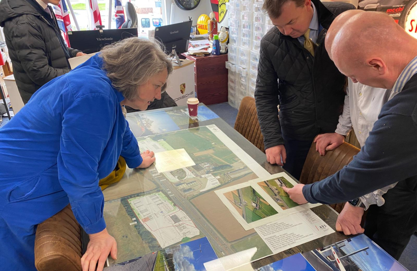 Jill Mortimer and Guy Opperman look at plans spread over a table
